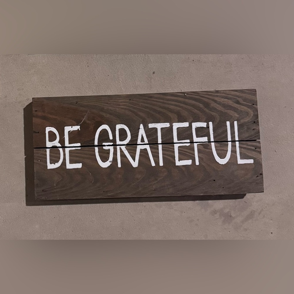 Wooden Sign with 'Be Grateful' Text